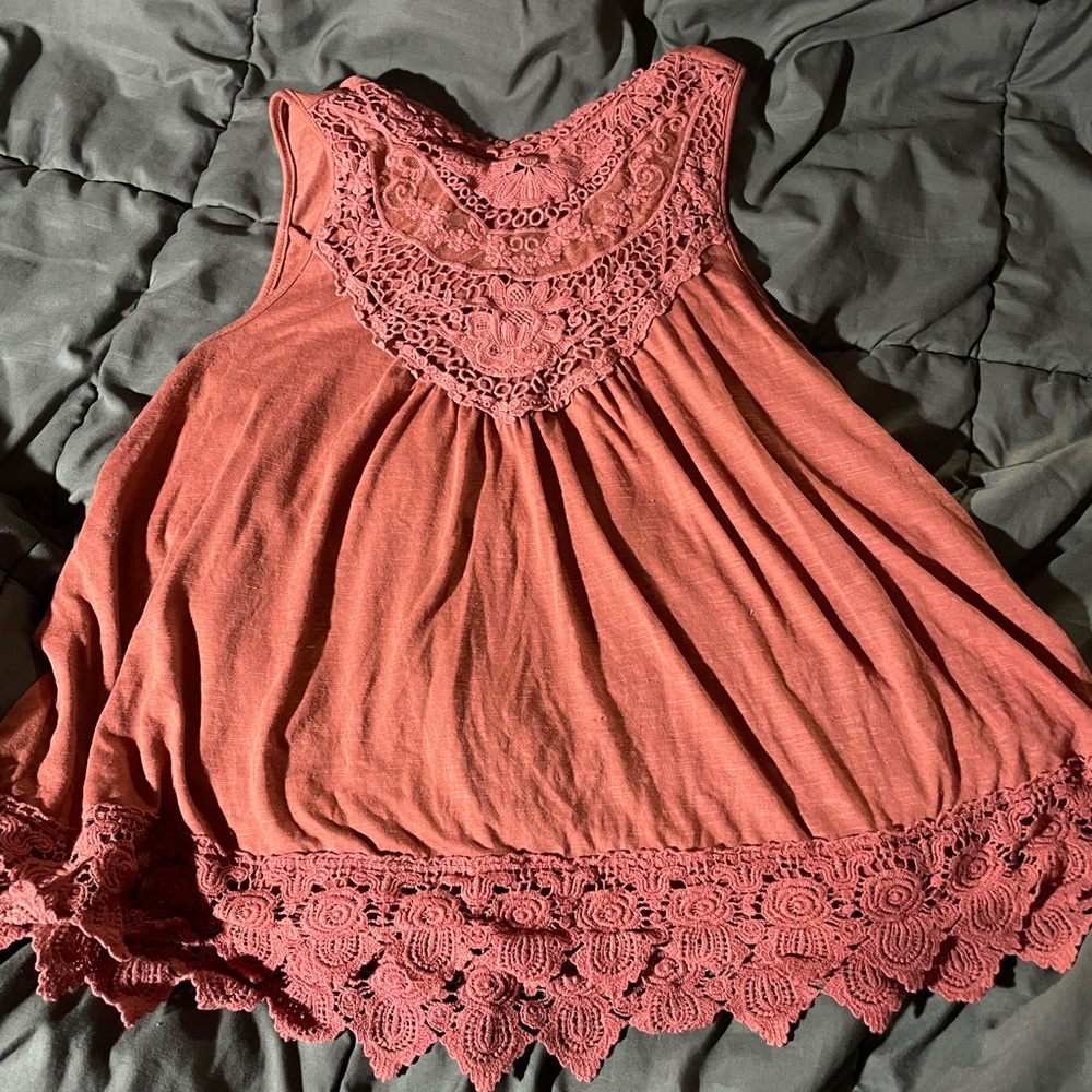 Pink sleeveless top with lace detail